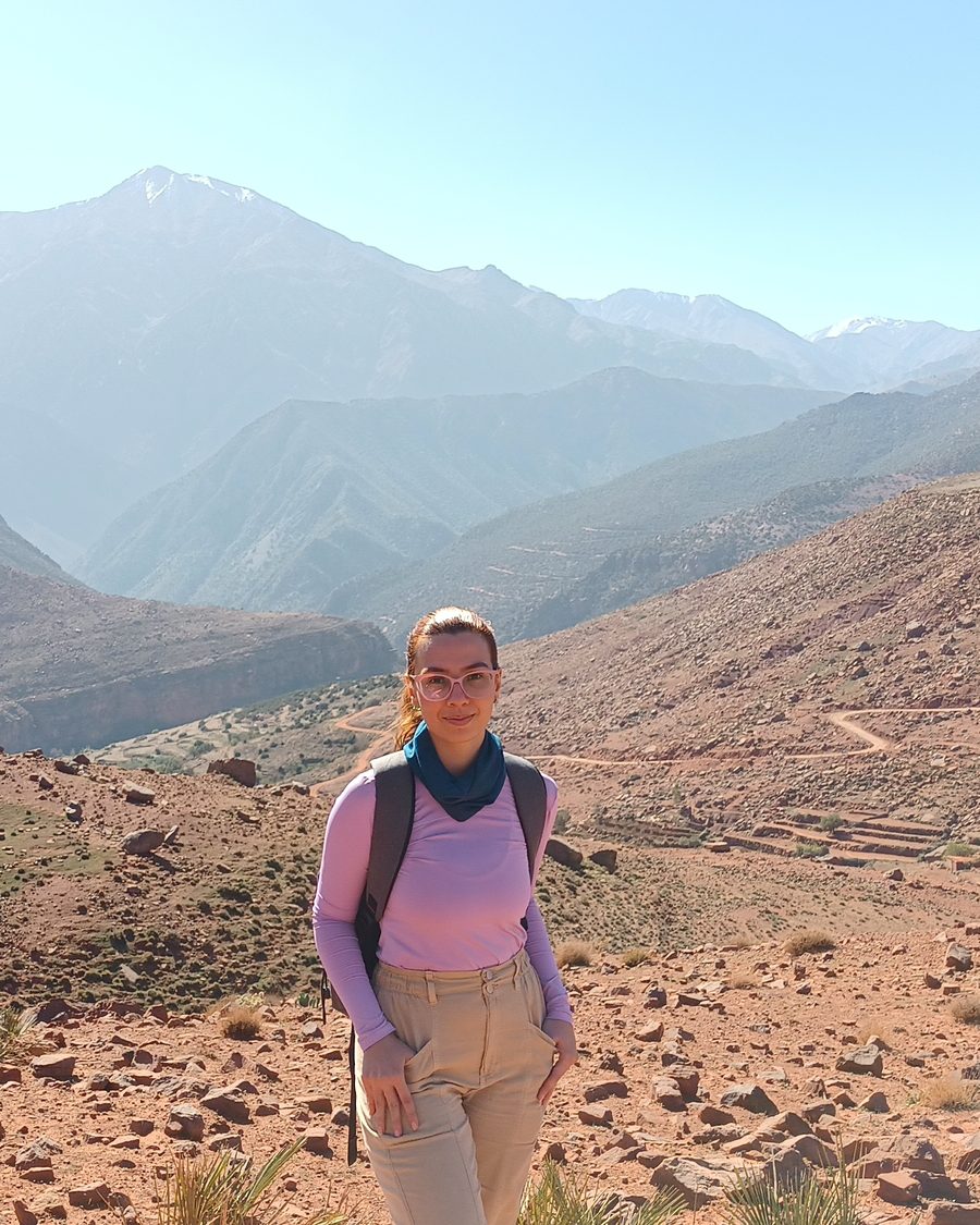 Laís Carneiro standing on a ridge in the Atlas mountains, Morocco